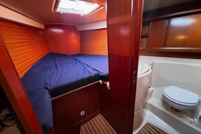 Slide: The Image of Cabin interior of 2003 Grand Soleil 44 yacht with bed and bathroom. - 27