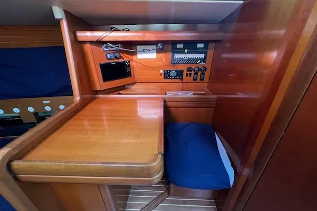 Slide: The Image of Navigation station in 2003 Grand Soleil 44 yacht with wooden desk and control panel. - 33