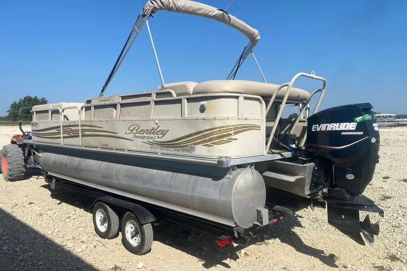 Slide: The Image of 2008 Bentley Pontoons Prestige 223LC on trailer with Evinrude outboard motor. - 3
