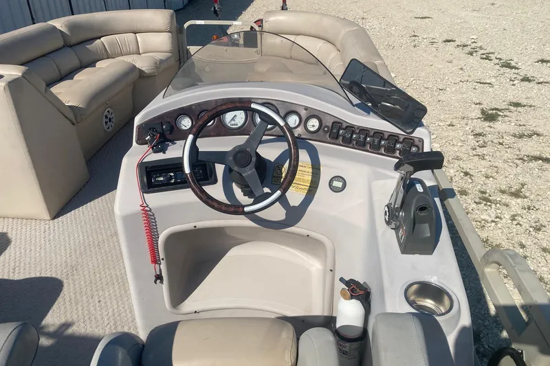 Slide: The Image of 2008 Bentley Pontoons Prestige 223LC helm with steering wheel and control panel. - 7