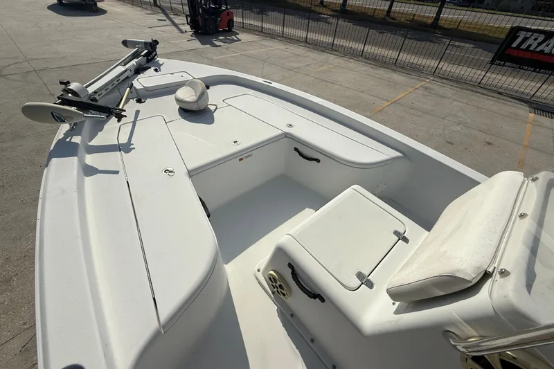 Slide: The Image of 2008 Champion 220 Bay boat interior with seating and storage compartments. - 10