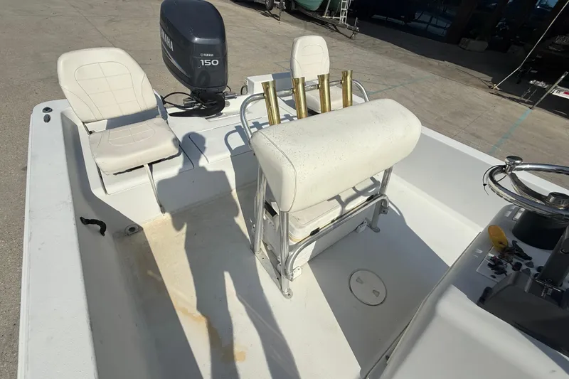 Slide: The Image of 2008 Champion 220 Bay boat interior with Yamaha 150 outboard motor. - 12