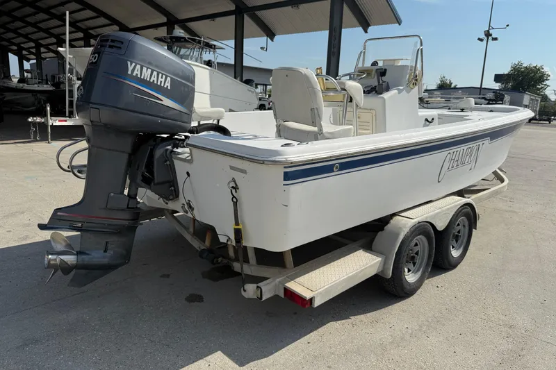 Slide: The Image of 2008 Champion 220 Bay boat with Yamaha outboard motor on trailer. - 7
