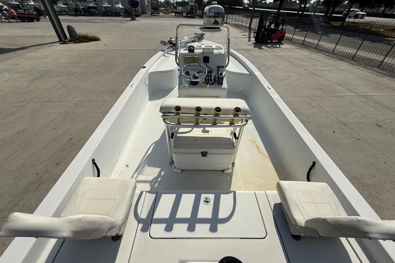 Slide: The Image of 2008 Champion 220 Bay boat interior with seating and steering console. - 8