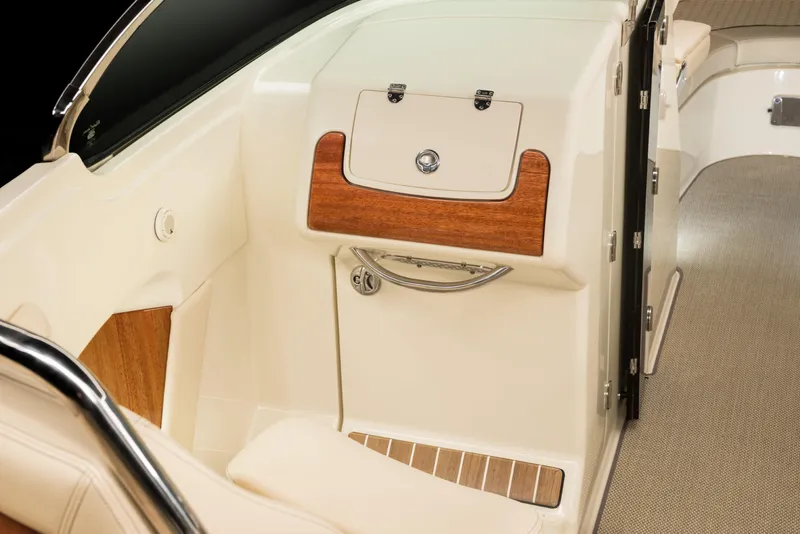 Slide: The Image of 2024 Chris-Craft Launch 28 GT interior detail with wood accents and storage compartment. - 11