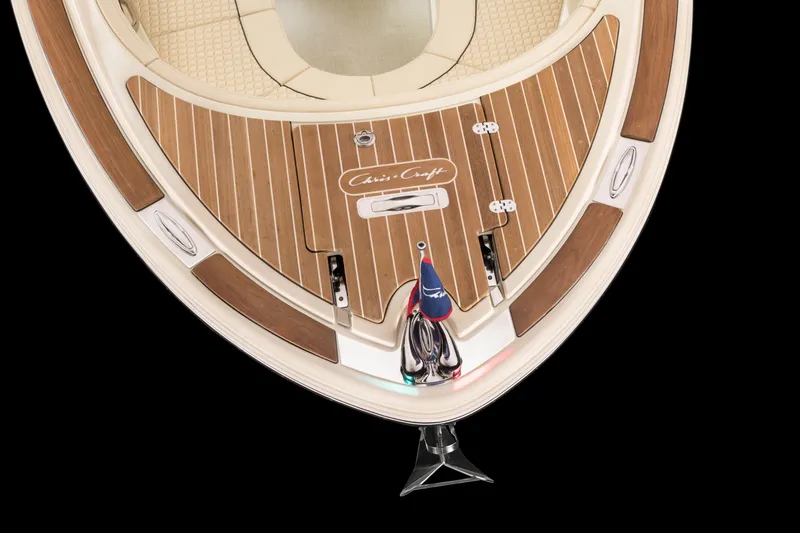 Slide: The Image of 2024 Chris-Craft Launch 28 GT bow with teak decking and flag. - 13