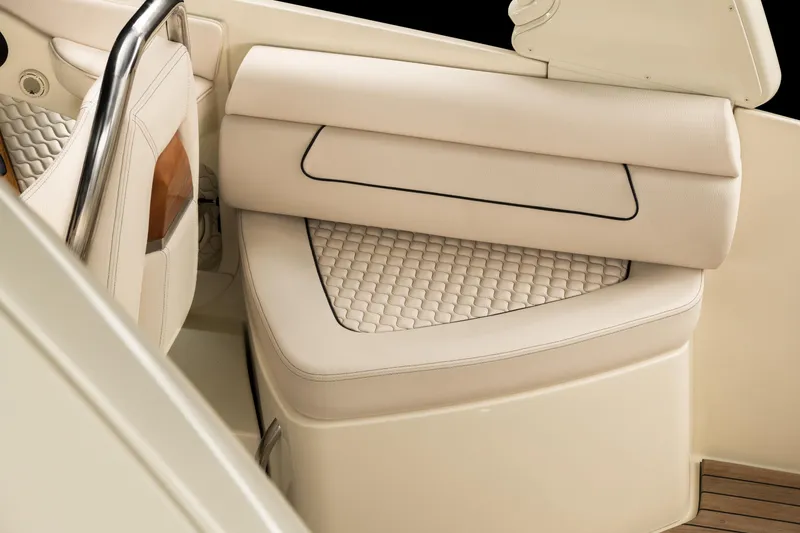 Slide: The Image of 2024 Chris-Craft Launch 28 GT boat interior seating with beige upholstery. - 16