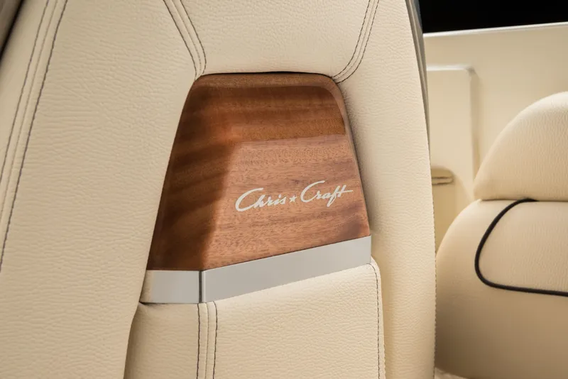 Slide: The Image of 2024 Chris-Craft Launch 28 GT interior detail with wood and leather accents. - 7