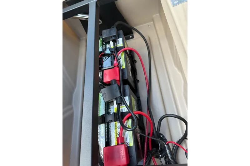Slide: The Image of Battery compartment of 2025 Bentley Pontoons Legacy 223 QSB with wiring and connectors. - 18