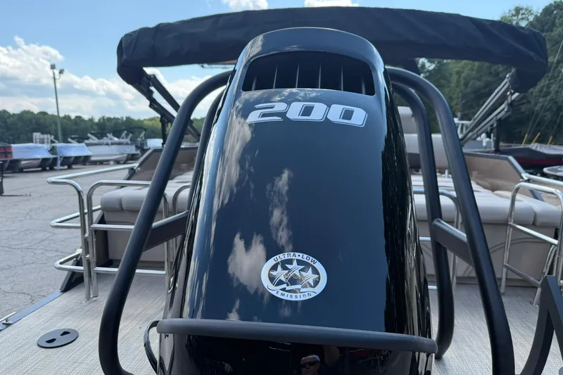 Slide: The Image of 2025 Bentley Pontoons Legacy 223 QSB with 200 HP engine, docked outdoors. - 5