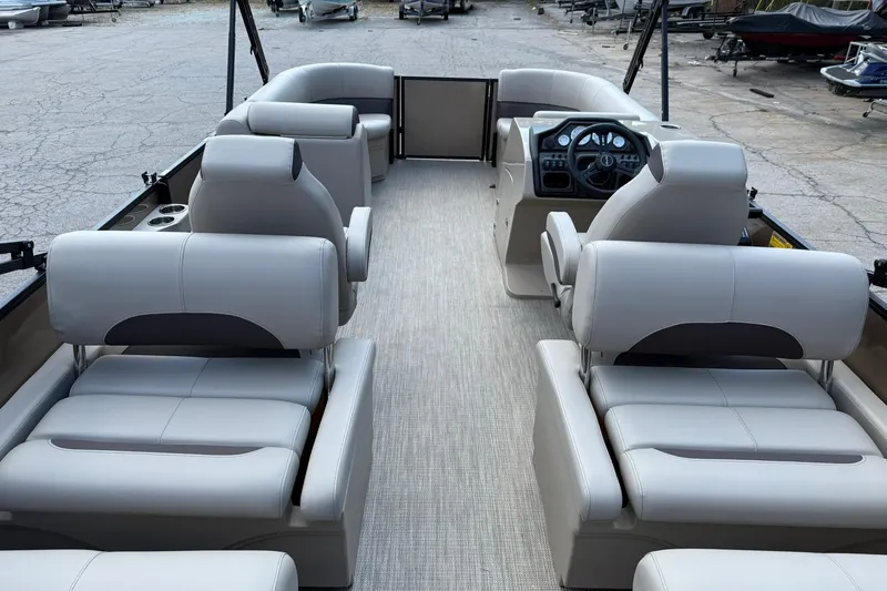 Slide: The Image of 2025 Bentley Pontoons Legacy 223 QSB interior with luxurious seating and modern dashboard. - 6