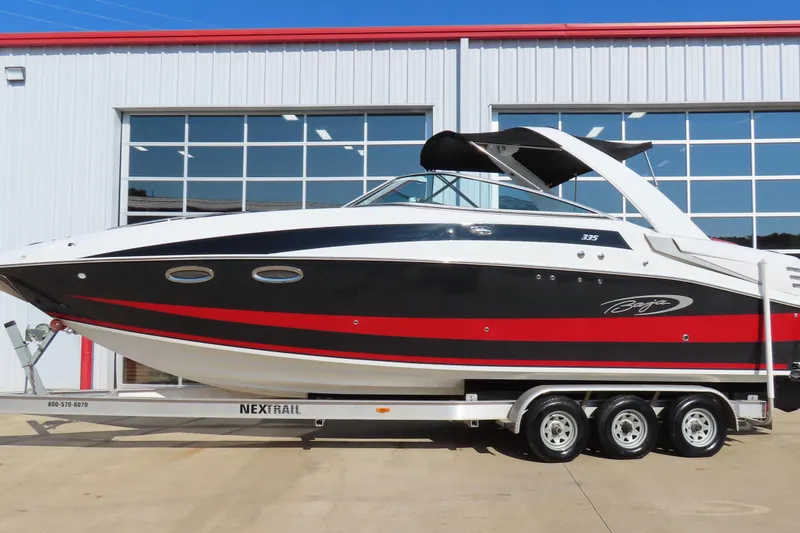 The Image of 2008 Baja 335 Performance boat on trailer, sleek design, red and black accents. - 0