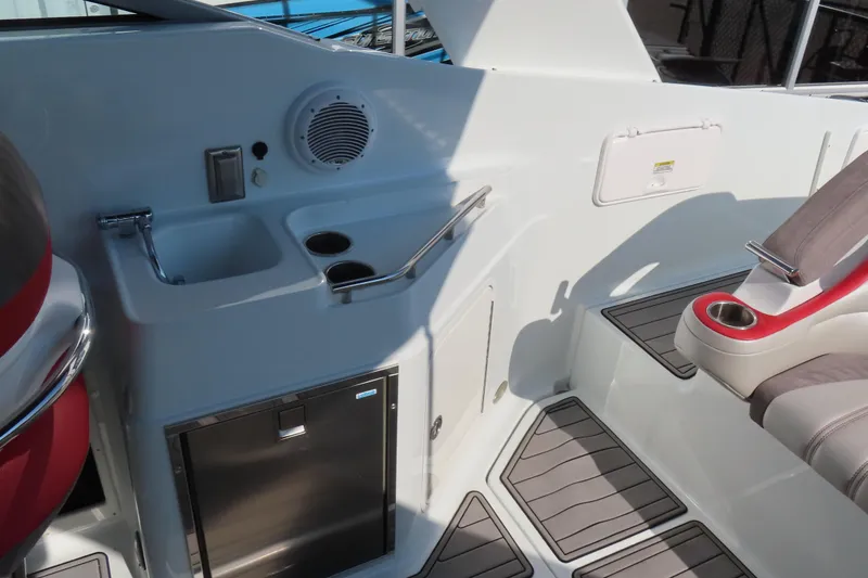 Slide: The Image of 2008 Baja 335 Performance boat interior with sink, cup holders, and seating area. - 10