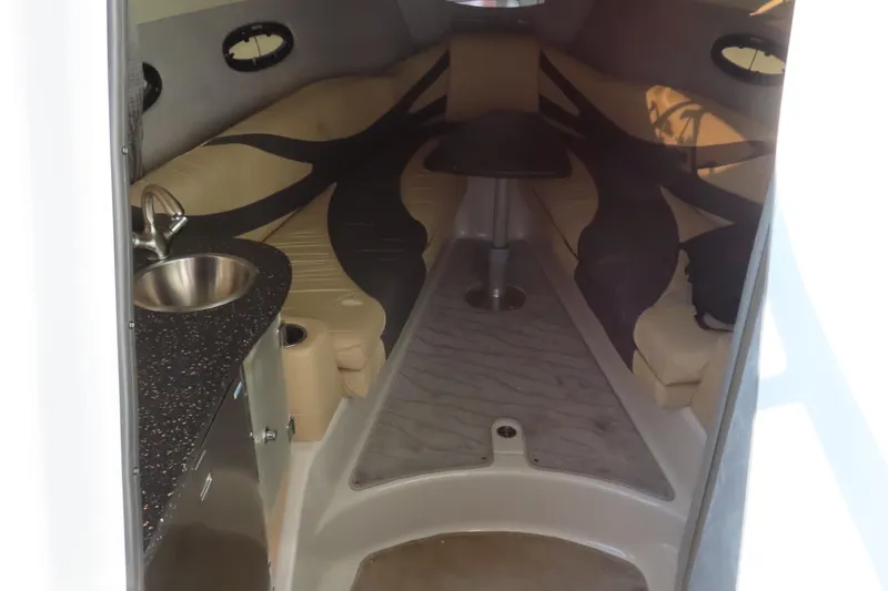 Slide: The Image of 2008 Baja 335 Performance boat interior with seating, table, and sink. - 14
