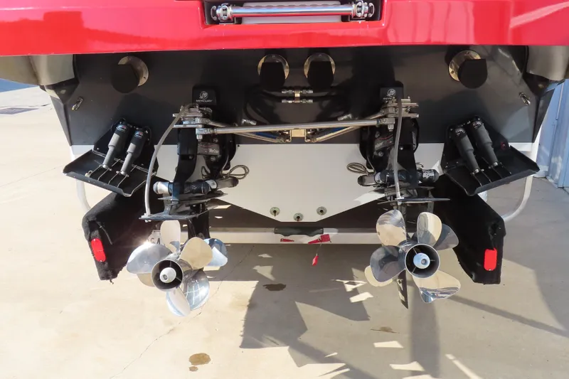 Slide: The Image of Rear view of 2008 Baja 335 Performance boat with dual propellers and trim tabs. - 6
