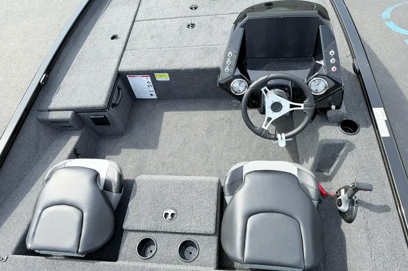 Slide: The Image of 2025 Crestliner XF 179 boat interior with dual seats and steering console. - 3