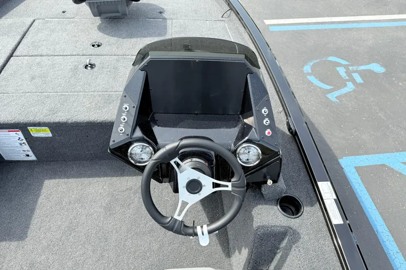 Slide: The Image of 2025 Crestliner XF 179 boat dashboard with steering wheel and control panel. - 7