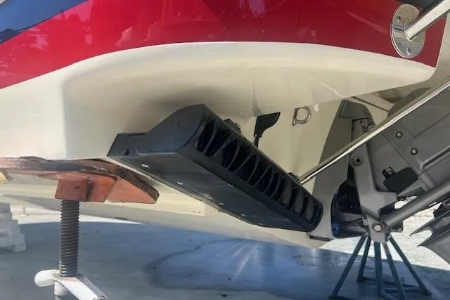 Slide: The Image of 2024 Chris-Craft Launch 27 boat with sleek design, docked outdoors under blue sky. - 3