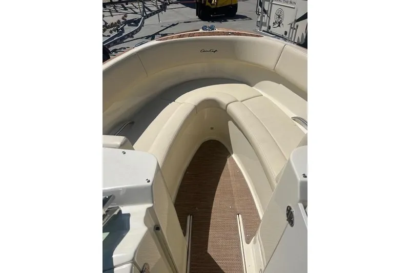 Slide: The Image of 2024 Chris-Craft Launch 27 boat cockpit with steering wheel and control panel. - 5