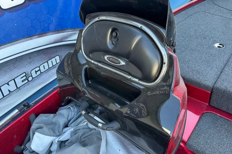 Slide: The Image of 2024 Nitro Z17 boat storage compartment with open lid, showcasing interior space. - 17