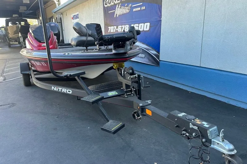 Slide: The Image of 2024 Nitro Z17 boat on trailer, parked outside dealership. - 3