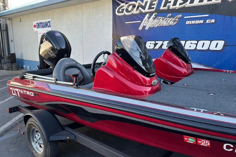 Slide: The Image of 2024 Nitro Z17 boat in red, displayed at a marine dealership. - 6