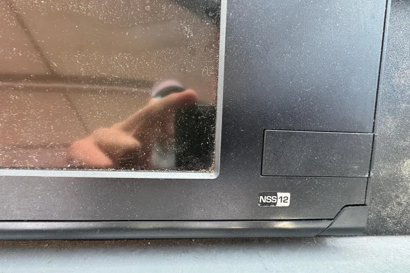 Slide: The Image of Close-up of a dusty NSS12 display on a 1999 Tiara Yachts 2900 Open. - 17