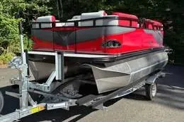 The Image of 2026 Avalon VENTURE CRUISE pontoon boat on trailer, red and silver design. - 0