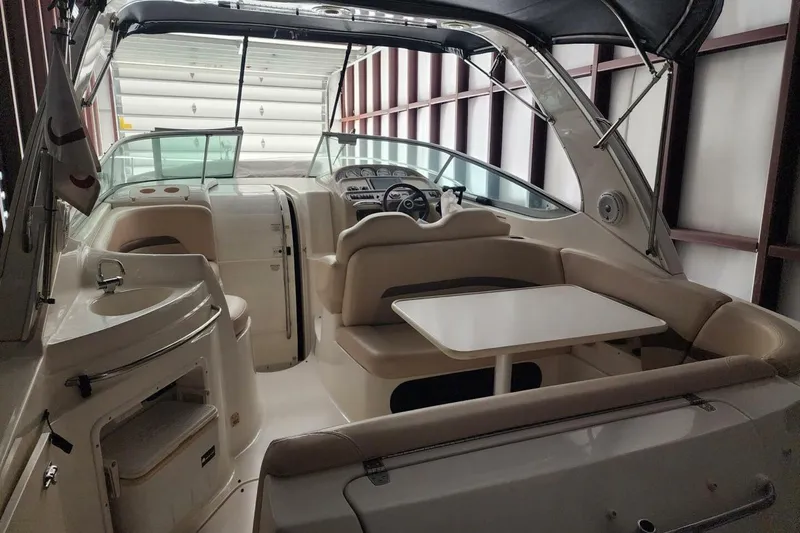 Slide: The Image of 2006 Chaparral Signature 290 bathroom with sink, mirror, and storage shelves. - 11