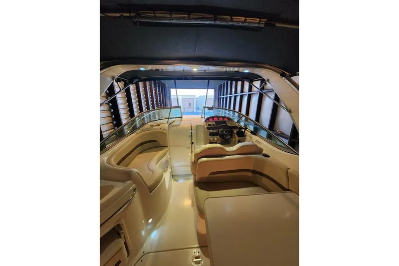Slide: The Image of 2006 Chaparral Signature 290 boat in storage, rear view with canopy. - 12