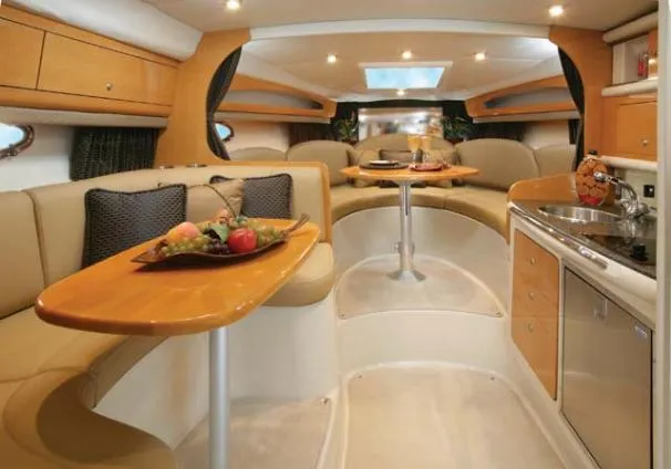 Slide: The Image of 2006 Chaparral Signature 290 boat interior with beige seating and glass door. - 15