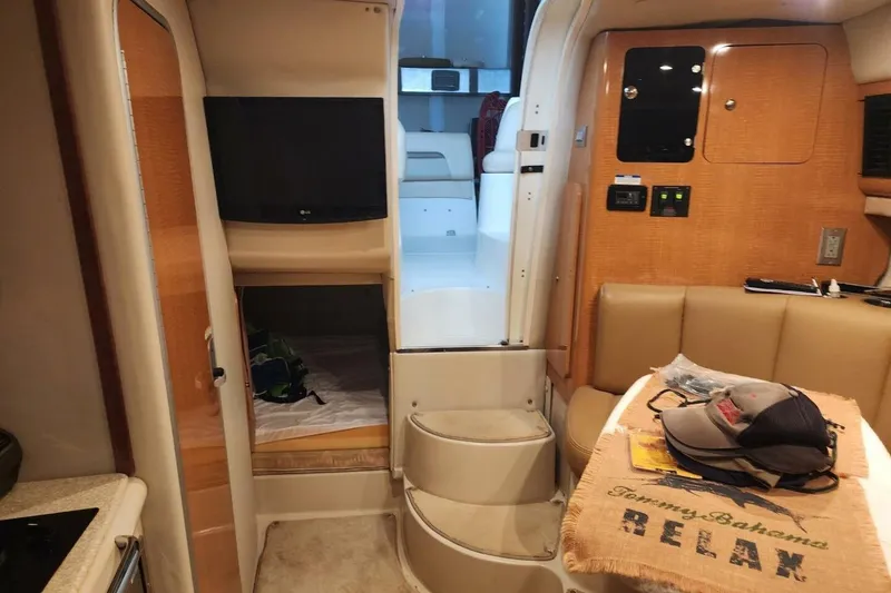 Slide: The Image of Interior of 2006 Chaparral Signature 290 boat with TV and seating area. - 20