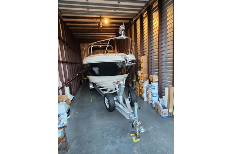 Slide: The Image of 2006 Chaparral Signature 290 boat stored indoors, rear view. - 3