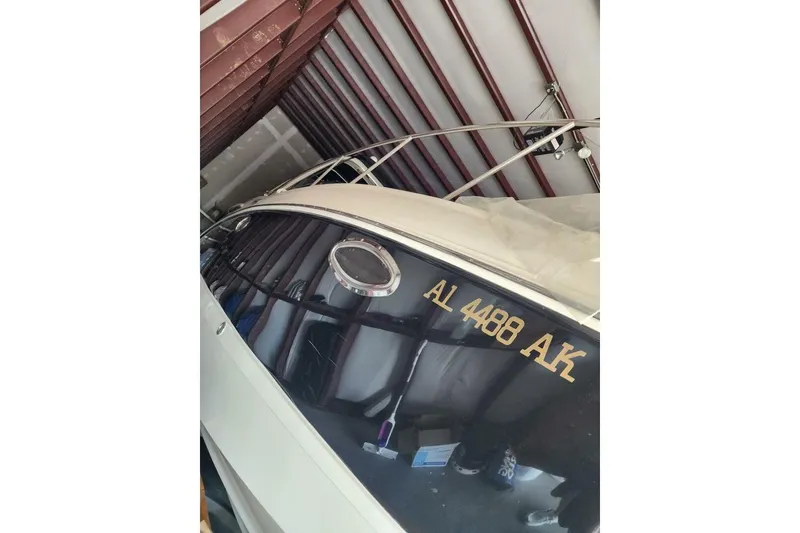 Slide: The Image of 2006 Chaparral Signature 290 yacht kitchen with microwave, sink, and stove. - 9