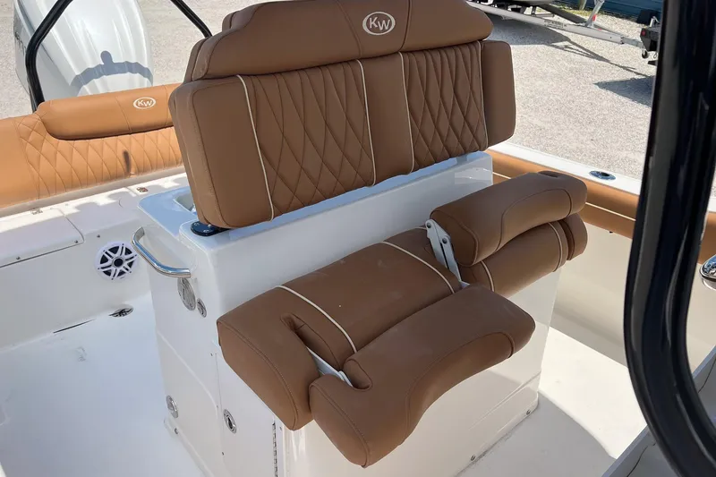 Slide: The Image of 2026 Key West 239 FS boat interior with tan leather seating and white accents. - 11