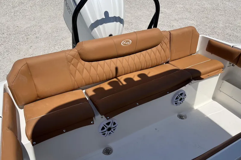 Slide: The Image of 2026 Key West 239 FS boat with tan leather seating and speaker system. - 15