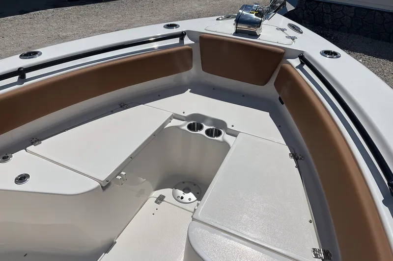 Slide: The Image of 2026 Key West 239 FS boat interior with cushioned seating and storage compartments. - 17