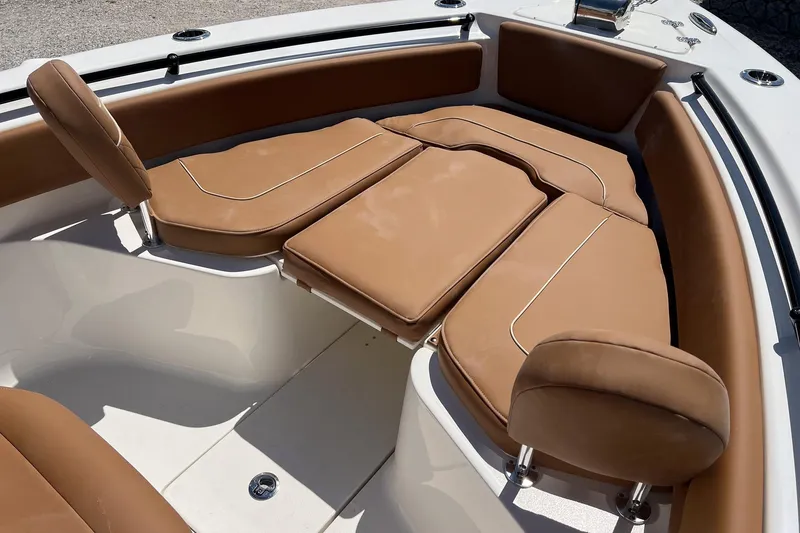 Slide: The Image of 2026 Key West 239 FS boat interior with tan cushioned seating. - 20