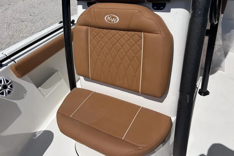 Slide: The Image of Brown leather seat on 2026 Key West 239 FS boat, featuring diamond stitching and white piping. - 22