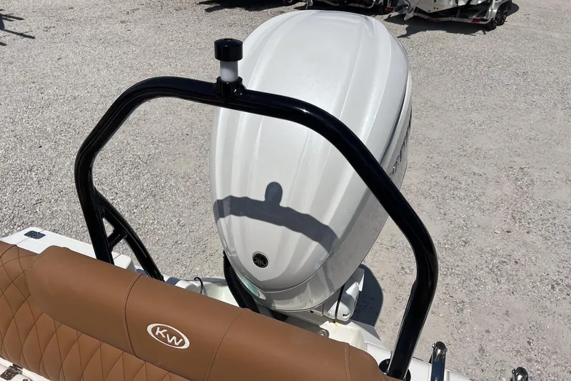 Slide: The Image of 2026 Key West 239 FS boat engine and seating detail in sunlight. - 24
