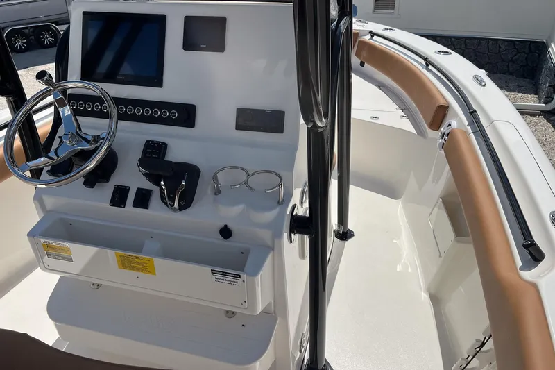 Slide: The Image of 2026 Key West 239 FS boat cockpit with steering wheel and control panel. - 25