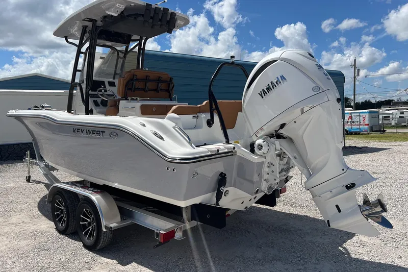 Slide: The Image of 2026 Key West 239 FS boat with Yamaha engine on trailer, parked outdoors. - 3