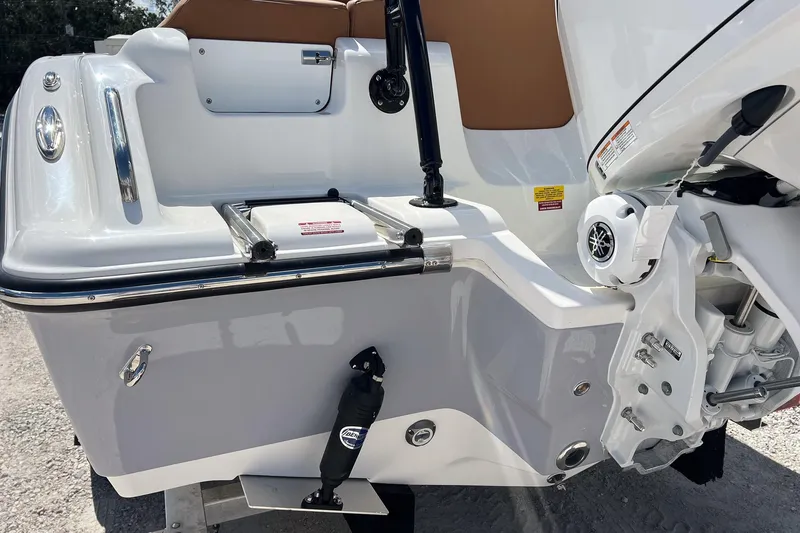 Slide: The Image of 2026 Key West 239 FS boat stern with ladder and motor details. - 7