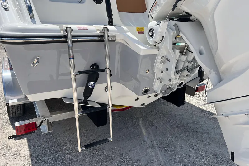 Slide: The Image of Rear view of 2026 Key West 239 FS boat with ladder and motor details. - 8