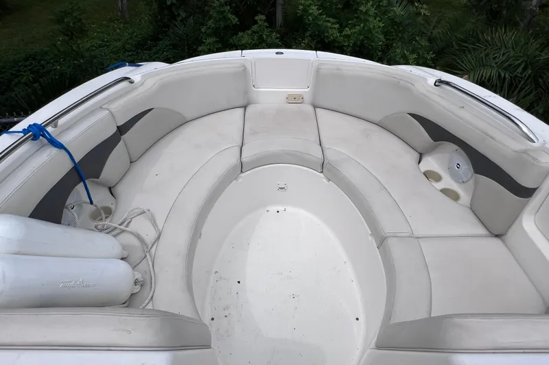 Slide: The Image of 2004 Chaparral Sunesta 254 boat interior with spacious seating and cup holders. - 15