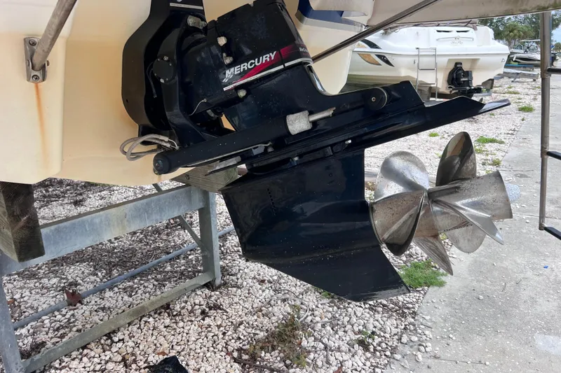 Slide: The Image of 2004 Chaparral Sunesta 254 boat with Mercury outboard motor and propeller. - 19