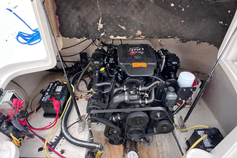 Slide: The Image of Engine compartment of a 2004 Chaparral Sunesta 254 boat, featuring a MerCruiser 350 Mag MPI engine. - 20
