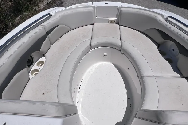 Slide: The Image of 2004 Chaparral Sunesta 254 boat interior with spacious seating and cup holders. - 27