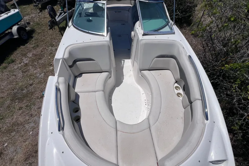 Slide: The Image of 2004 Chaparral Sunesta 254 boat with spacious seating and cup holders, viewed from above. - 28