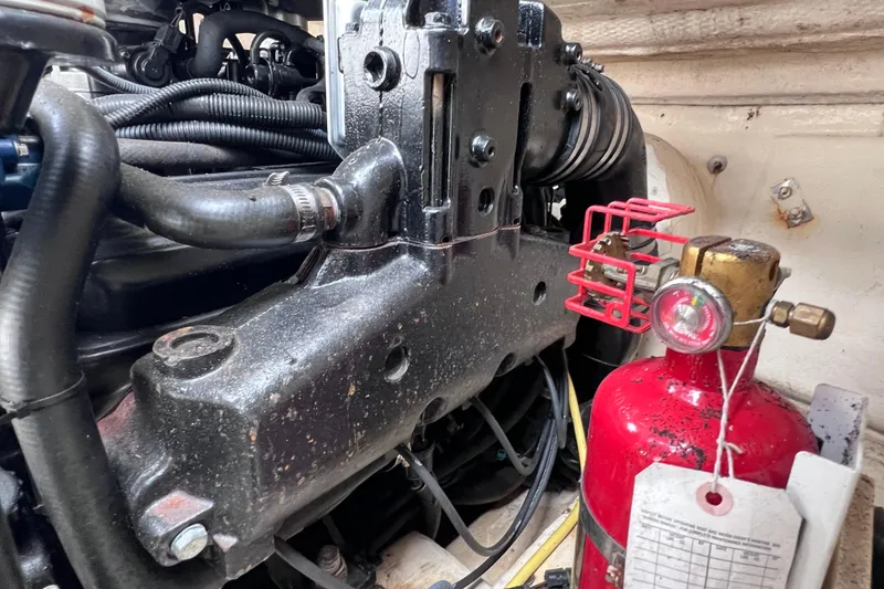Slide: The Image of Engine compartment of a 2004 Chaparral Sunesta 254 with fire extinguisher. - 34